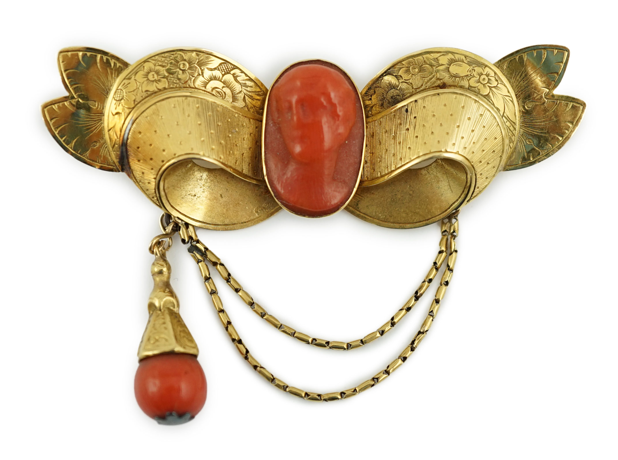 An early 20th century engraved gold and coral set drop brooch